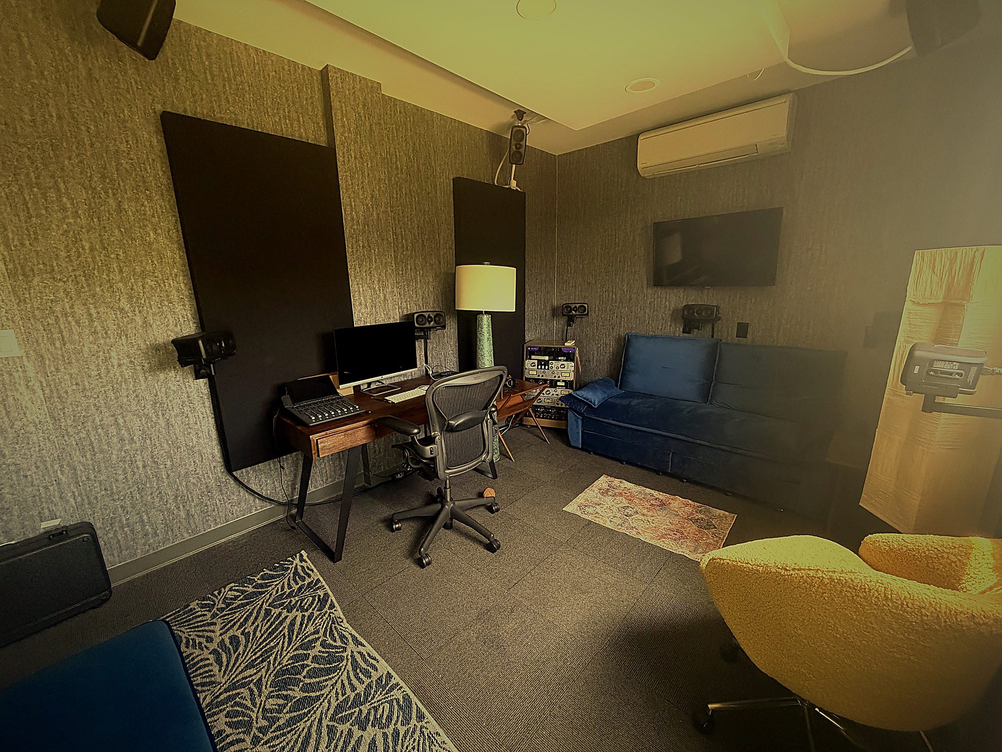 Mix This! Lounge with Dolby Atmos listening, surround monitors, Aeron chair, and lounge seating